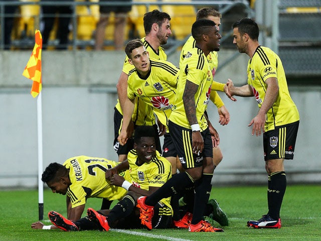 Roy Krishna (L) of the Phoenix celebrates with teammates after scoring a goal during the round three A-League match between the Wellington Phoenix and the Brisbane Roar at Westpac Stadium on October 24, 2015