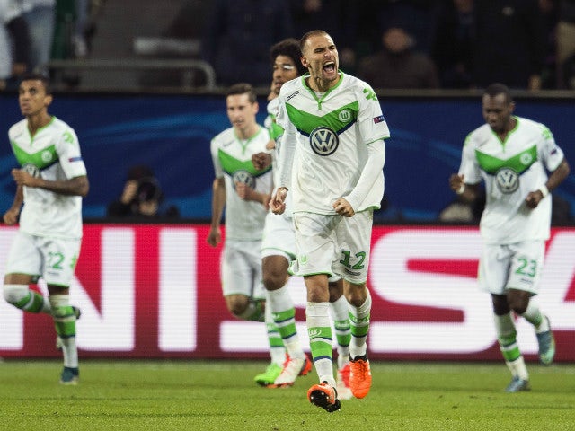 Wolfsburg's forward Bas Dost of the Netherlands celebrates scoring the opening goal during the Group B, first-leg UEFA Champions League football match VfL Wolfsburg vs PSV Eindhoven in Wolfsburg, northern Germany on October 21, 2015.
