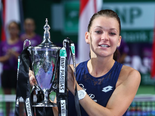  Agnieszka Radwanska of Poland holds the Billie Jean King Trophy after defeating Petra Kvitova of Czech Republic in the final match during the BNP Paribas WTA Finals at Singapore Sports Hub on November 1, 2015 in Singapore.