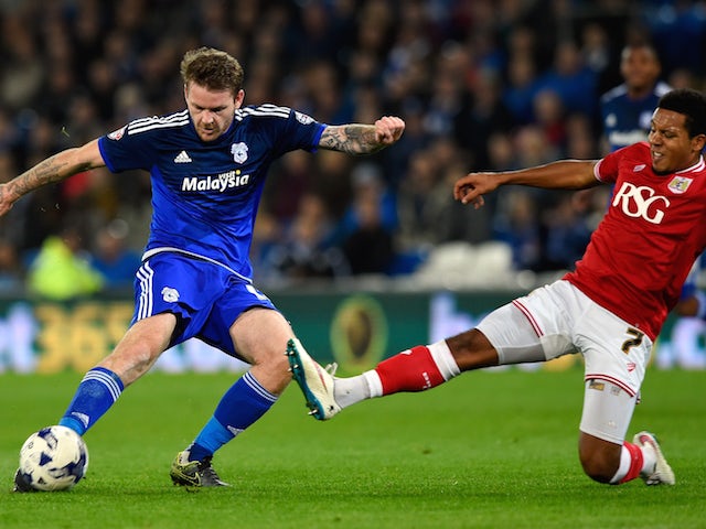 Bristol City player Korey Smith blocks the goalbound shot of Aron Gunnarsson of Cardiff during the Sky Bet Championship match between Cardiff City and Bristol City at Cardiff City Stadium on October 26, 2015 in Cardiff, United Kingdom.