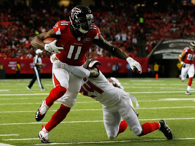 Julio Jones #11 of the Atlanta Falcons is tackled after a catch by Mike Jenkins #24 of the Tampa Bay Buccaneers during the first half at the Georgia Dome on November 1, 2015