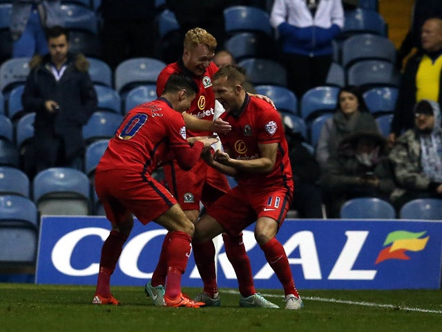 Jordan Rhodes (R) of Blackburn Rovers celebrates scoring with teamates during the Sky Bet Championship match between Leeds United and Blackburn Rovers on October 29, 2015