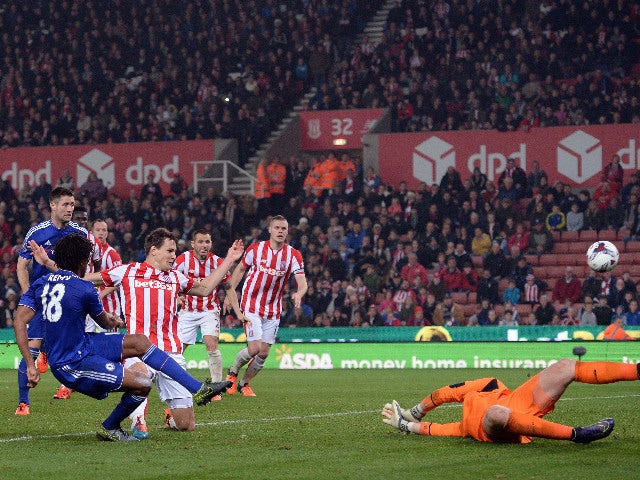Chelsea's French striker Loic Remy shoots to score his team's first goal during the English League Cup fourth round football match between Stoke City and Chelsea at the Britannia Stadium in Stoke-on-Trent, central England on October 27, 2015. 