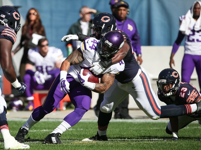 Kyle Fuller #23 of the Chicago Bears carries the football ahead of Stefon Diggs #14 of the Minnesota Vikings after making an interception in the second quarter at Soldier Field on November 1, 2015