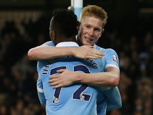Manchester City's Belgian midfielder Kevin De Bruyne (R) celebrates with Manchester City's Nigerian striker Kelechi Iheanacho after scoring their second goal during the English League Cup fourth round football match between Manchester City and Crystal Pal
