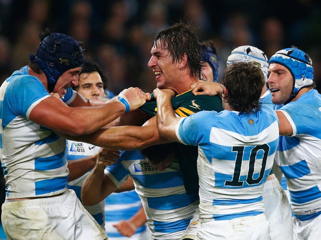 Eben Etzebeth of South Africa clashes with Tomas Lavanini and Nicolas Sanchez of Argentina during the 2015 Rugby World Cup Bronze Final match between South Africa and Argentina at the Olympic Stadium on October 30, 2015
