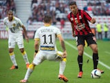 Lille's French midfielder Eric Bautheac (C) vies with Nice's French forward Hatem Ben Arfa (R) during the French L1 football match OGC Nice vs Lille at the Allianz Riviera stadium in Nice, southeastern France, on November 1, 2015.