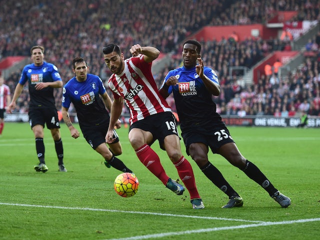 Graziano Pelle of Southampton shields the ball from Sylvain Distin of Bournemouth during the Barclays Premier League match between Southampton and A.F.C. Bournemouth at St Mary's Stadium on November 1, 2015 in Southampton, England.