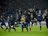 Inter Milan's players celebrate after the Italian Serie A football match Inter Milan vs AS Roma on October 31, 2015 at the San Siro Stadium in Milan.