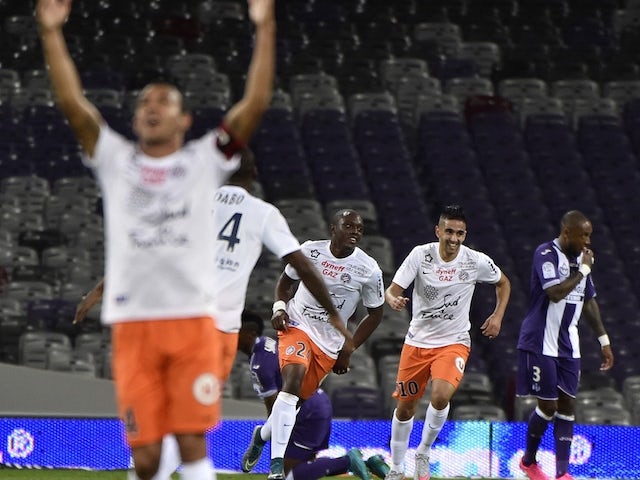 Montpellier's French forward Jerome Roussillon (C) celebrates with teammates after scoring a goal during the French L1 football match Toulouse against Montpellier on October 31, 2015 at the Municipal Stadium in Toulouse.