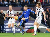 Jamie Vardy (C) of Leicester City controls the ball against Jonny Evans (L) and Gareth McAuley (R) of West Bromwich Albion during the Barclays Premier League match between West Bromwich Albion and Leicester City at The Hawthorns on October 31, 2015