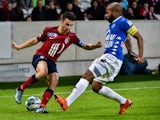 Lille's French defender Sebastien Corchia (L) vies with Troyes' French midfielder Quentin Othon during the French League Cup football match Lille vs Troyes on October 28, 2015 at the Pierre-Mauroy stadium in Villeneuve d'Ascq, northern France. 