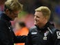 Liverpool's German manager Jurgen Klopp (L) shakes hands with Bournemouth's English manager Eddie Howe ahead of the English League Cup fourth round football match between Liverpool and Bournemouth at Anfield stadium in Liverpool, north west England on Oct