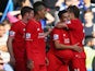 Philippe Coutinho (2nd R) of Liverpool celebrates scoring his team's first goal with his team mates during the Barclays Premier League match between Chelsea and Liverpool at Stamford Bridge on October 31, 2015 