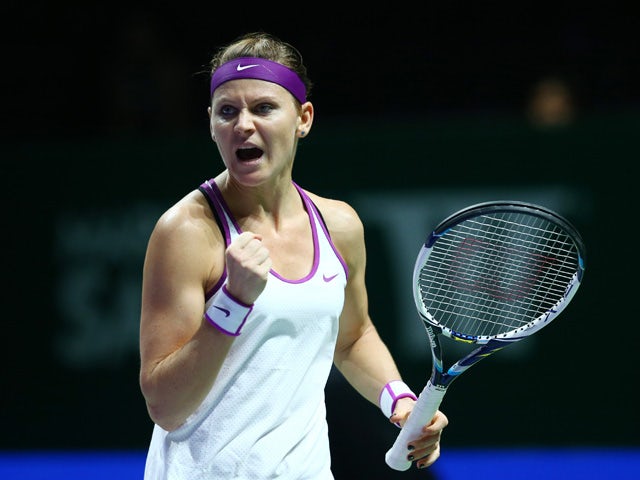 Lucie Safarova of Czech Republic reacts to a point against Angelique Kerber of Germany during the BNP Paribas WTA Finals at Singapore Sports Hub on October 30, 2015