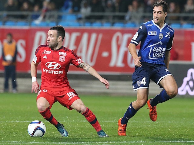 Lyon's French forward Mathieu Valbuena (L) vies with Troyes' French midfielder Thomas Ayasse (R) during the French L1 football match between Troyes and Lyon on October 31, 2015 at the Aube Stadium in Troyes.