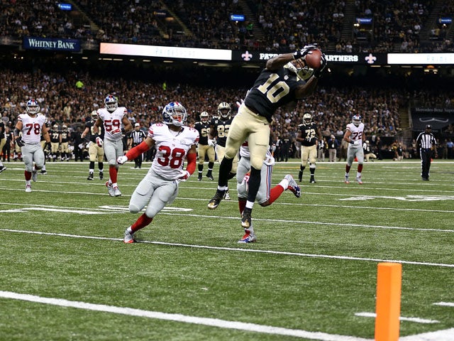 Brandin Cooks #10 of the New Orleans Saints catches a pass for a touchdown during the third quarter of a game against the New York Giants at the Mercedes-Benz Superdome on November 1, 2015