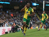 Cameron Jerome of Norwich City celebrates scoring his team's first goal during the Barclays Premier League match between Manchester City and Norwich City at Etihad Stadium on October 31, 2015