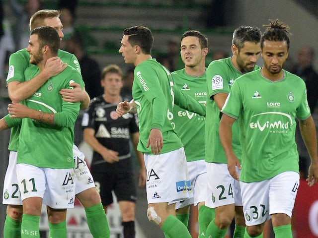 Saint-Etienne's players celebrates after scoring a goal during the French L1 football match Saint-Etienne (ASSE) vs Reims (SDR) on October 31, 2015, at the Geoffroy Guichard Stadium in Saint-Etienne, central France.