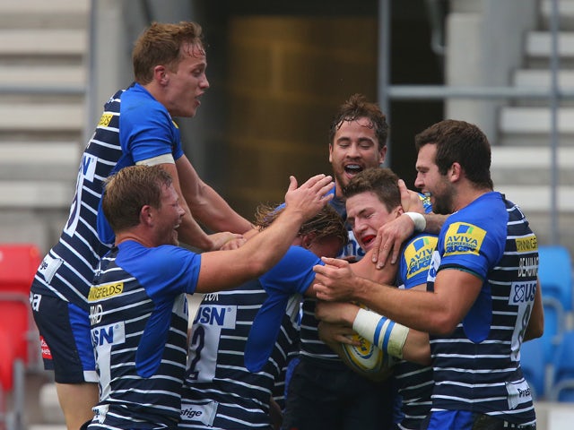 Sale Sharks players congratulate Sam James, second from right, after he scored his side's first try of the match during the Aviva Premiership match between Sale Sharks and Northampton Saints at the AJ Bell Stadium on November 1, 2015 
