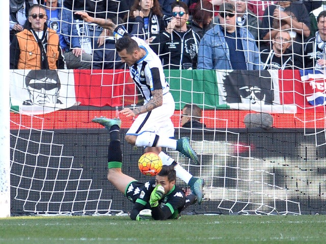 Andrea Cosigli goalkeeper of US Sassuolo makes a save at the feet of Cyril Thereau of Udinese Calcio during the Serie A match between Udinese Calcio and US Sassuolo Calcio at Stadio Friuli on November 1, 2015