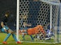Sheffield Wednesday's English defender Sam Hutchinson (R) beats Arsenal's Czech goalkeeper Petr Cech (C) to score the team's third goal during the English League Cup fourth round football match between Sheffield Wednesday and Arsenal at The Hillsborough S