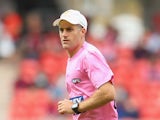 Former Australian cricketer Simon Katich runs as a trainer during the round three AFL match between the Greater Western Sydney Giants and the Melbourne Demons at Spotless Stadium on April 6, 2014