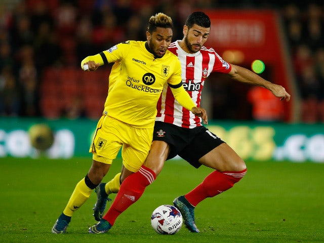 Jordan Amavi of Aston Villa is challenged by Graziano Pelle of Southampton during the Capital One Cup Fourth Round match between Southampton v Aston Villa at St Mary's Stadium on October 28, 2015 in Southampton, England.