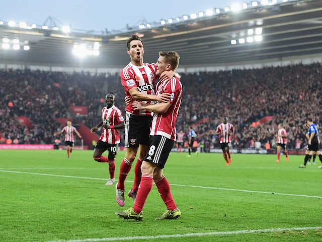 Steven Davis of Southampton (8) celebrates with Cedric Soares of Southampton as he scores their first goal during the Barclays Premier League match between Southampton and A.F.C. Bournemouth at St Mary's Stadium on November 1, 2015 in Southampton, England