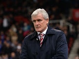 Stoke City's Welsh manager Mark Hughes arrives on the pitch for the second half of the English League Cup fourth round football match between Stoke City and Chelsea at the Britannia Stadium in Stoke-on-Trent, central England on October 27, 2015. 