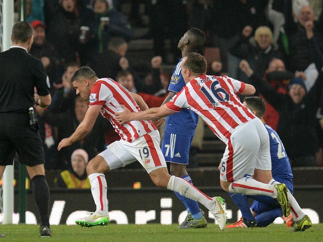 Stoke City's English-born Irish striker Jonathan Walters (C) celebrates scoring his team's first goal during the English League Cup fourth round football match between Stoke City and Chelsea at the Britannia Stadium in Stoke-on-Trent, central England on O