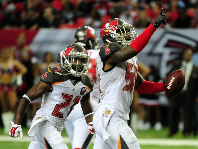 Kwon Alexander #58 of the Tampa Bay Buccaneers celebrates an interception during the first half against the Atlanta Falcons at the Georgia Dome on November 1, 2015