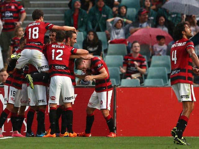 Wanderers players celebrate a goal by Dario Vidosic during the round four A-League match between the Western Sydney Wanderers and Perth Glory at Pirtek Stadium on November 1, 2015