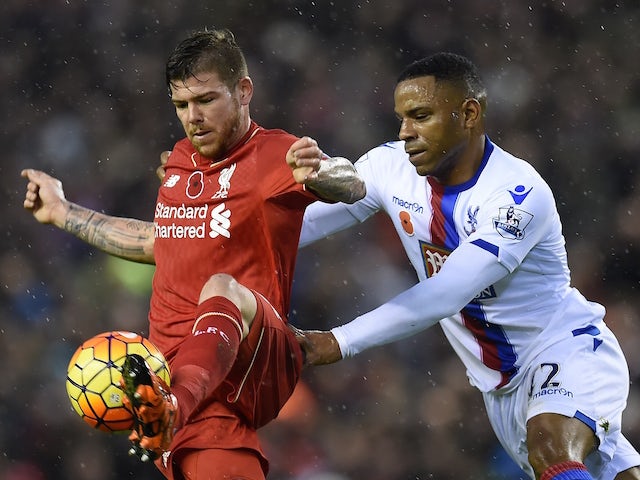Liverpool's Spanish defender Alberto Moreno (L) vies against Crystal Palace's English midfielder Jason Puncheon during the English Premier League football match between Liverpool and Crystal Palace at the Anfield stadium in Liverpool, north-west England o