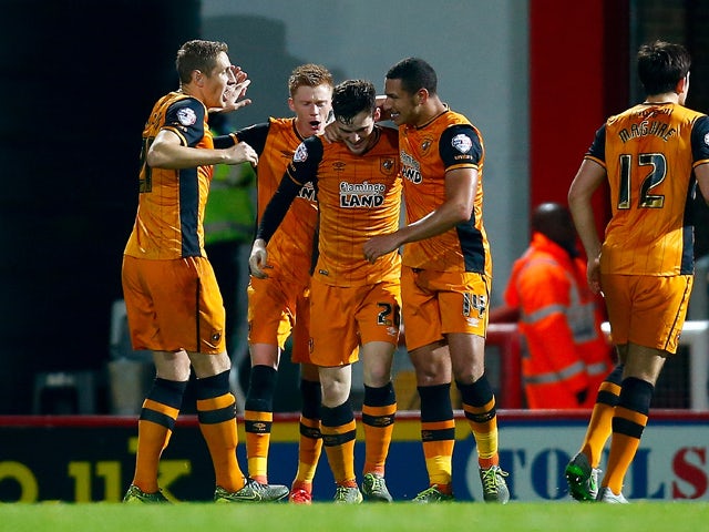 Hull celebrate with Andrew Robertson after he scores to make it 1-0 during the Sky Bet Championship match between Brentford and Hull City on November 3, 2015
