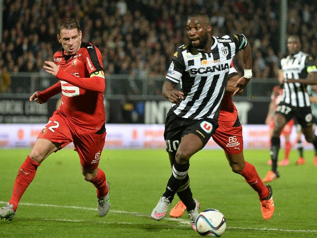 Angers' French forward Gilles Sunu (R) evades Rennes' French defender Sylvain Armand (L) during the French L1 football match between Angers (SCO) and Rennes (Stade Rennais FC) on November 6, 2015 at the Jean Bouin stadium, in Angers, western France.