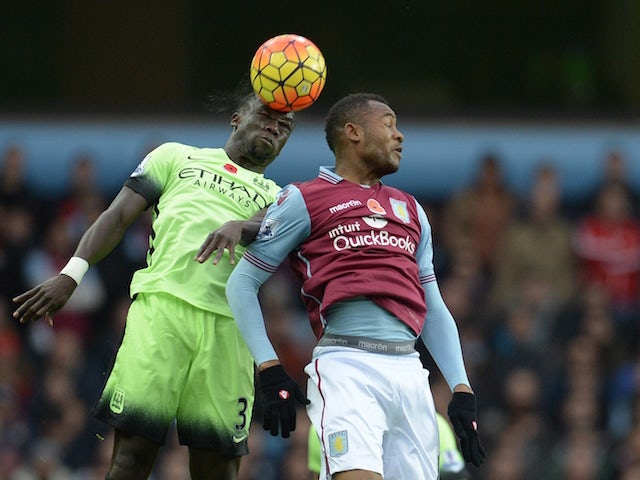 Manchester City's French defender Bacary Sagna (L) jumps for a header with Aston Villa's Ghanian striker Jordan Ayew during the English Premier League football match between Aston Villa and Manchester City at Villa Park in Birmingham, central England on N
