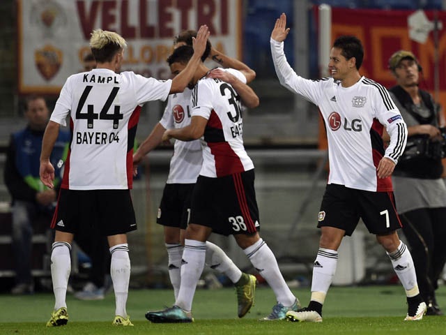 Leverkusen's Mexican forward Javier Hernandez (R) celebrates with teammates after scoring during the UEFA Champions League football match AS Roma vs Bayer Leverkusen on November 4, 2015