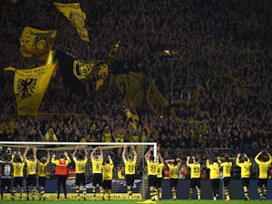 Dortmund charged after Tottenham fan injuries
