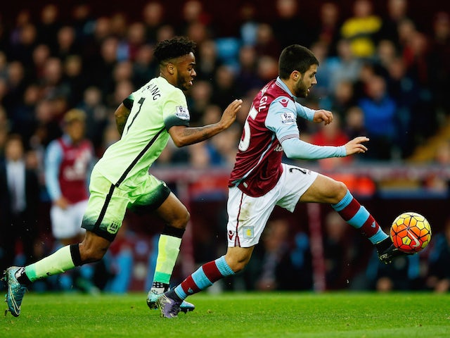 Carles Gil of Aston Villa is closed down by Raheem Sterling of Manchester City during the Barclays Premier League match between Aston Villa and Manchester City at Villa Park on November 8, 2015 in Birmingham, England.