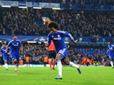 Chelsea's Brazilian midfielder Willian (C) celebrates after scoring from a free kick during a UEFA Chamions league group stage football match between Chelsea and Dynamo Kiev at Stamford Bridge stadium in west London on November 4, 2015