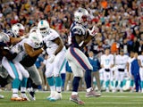 Dion Lewis #33 of the New England Patriots scores a touchdown during the second quarter against the Miami Dolphins at Gillette Stadium on October 29, 2015