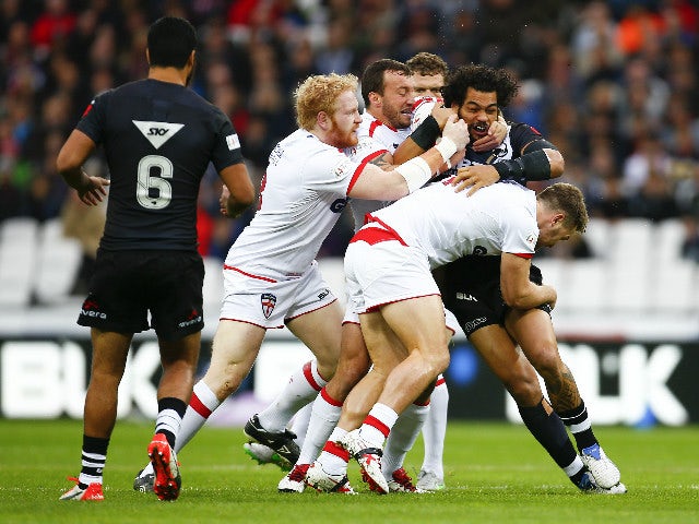 Adam Blair of New Zealand is tackled by Elliott Whitehead of England during the International Rugby League Test Series match between England and New Zealand at the Olympic Stadium on November 7, 2015 in London, England.