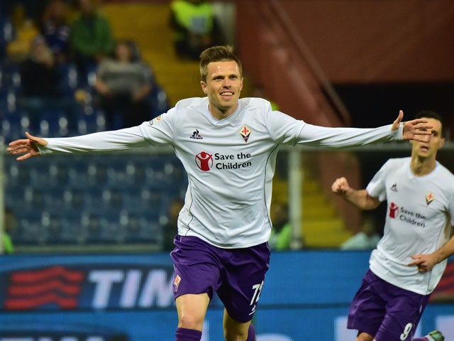 Fiorentina's midfielder from Slovenia Josip Ilicic celebrates after scoring a penalty during the Italian Seria A football match Sampdoria vs Fiorentina, on November 8, 2015