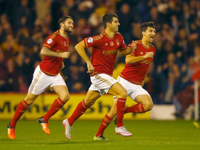 Nelson Oliveira of Nottingham Forest (2L) celebrates with team mates as he scores their first goal during the Sky Bet Championship match between Nottingham Forest and Derby County at City Ground on November 6, 2015 in Nottingham, England.