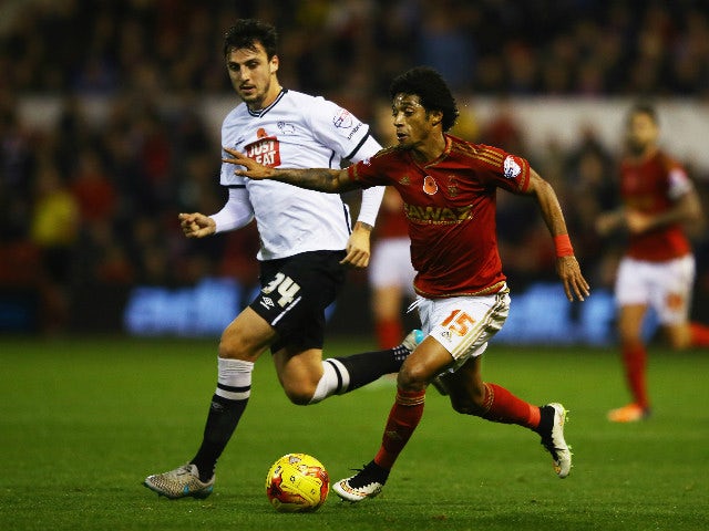 Ryan Mendes of Nottingham Forest takes on George Thorne of Derby County during the Sky Bet Championship match between Nottingham Forest and Derby County at City Ground on November 6, 2015 in Nottingham, England.