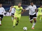 Gent's Belgian forward Laurent Depoitre (L) and Valencia's Brazilian defender Aderlan Santos vie for the ball during UEFA Champions League Group H second-leg football match between KAA Gent and Valencia CF at the KAA Gent Stadium in Ghent, Belgium on Nove