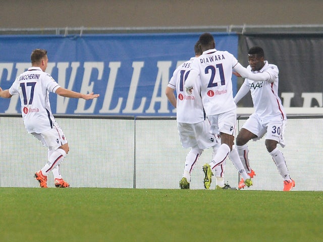 Godfred Donsah (R) of Bologna FC celebrate wit his team mate's after scoring his team's second goal during the Serie A match between Hellas Verona FC and Bologna FC at Stadio Marc'Antonio Bentegodi on November 7, 2015 in Verona, Italy.