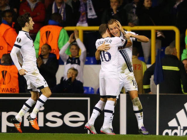 Harry Kane (R) of Spurs is congratulated by teammates Kieran Trippier (C) and Ryan Mason (L) after scoring the opening goal during the UEFA Europa League Group J match between Tottenham Hotspur FC and RSC Anderlecht at White Hart Lane on November 5, 2015 