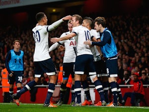 Harry Kane of Spurs (c) celebrates with his team mates after scoring his side's opening goal during the Barclays Premier League match between Arsenal and Tottenham Hotspur at the Emirates Stadium on November 8, 2015 in London, England.